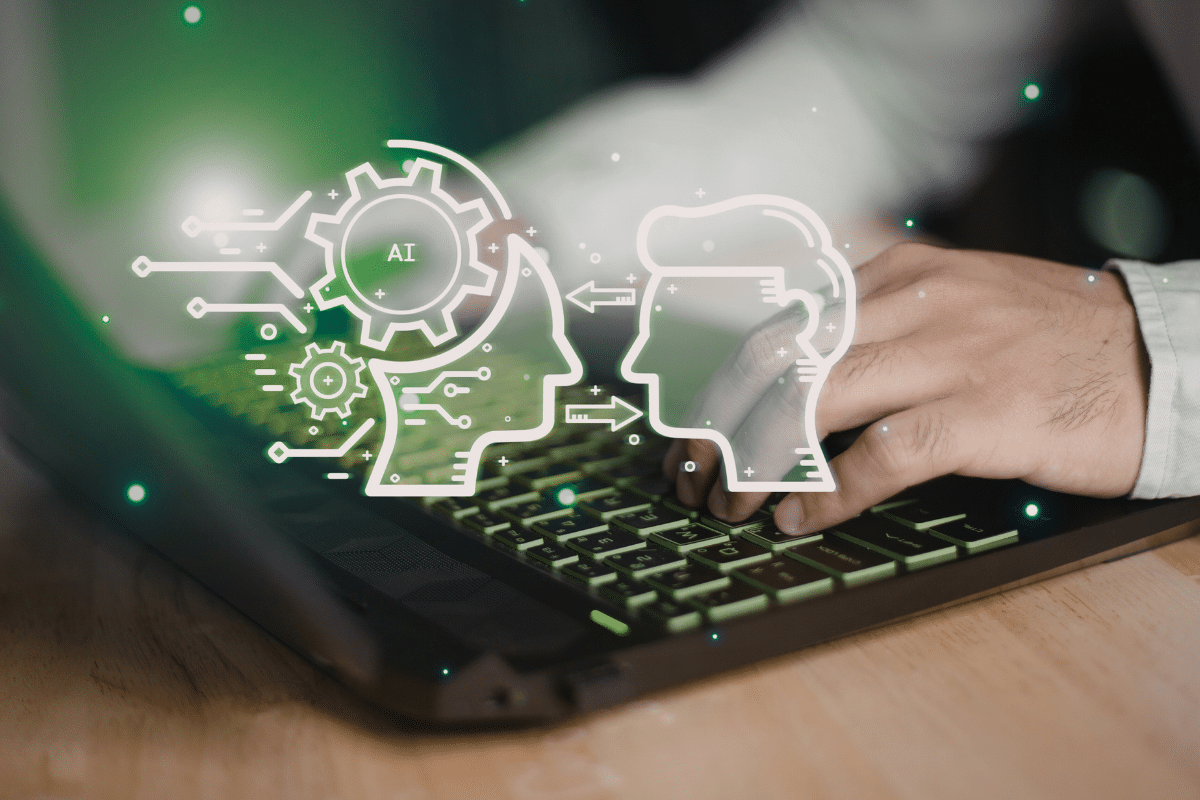 Hand bei der Nutzung des Laptops mit KI-Grafiken